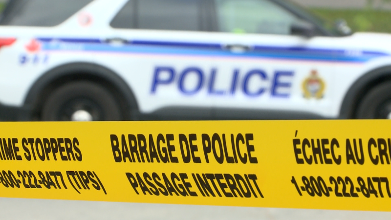 An Ottawa Police vehicle is seen behind police tape. (CTV News Ottawa)
