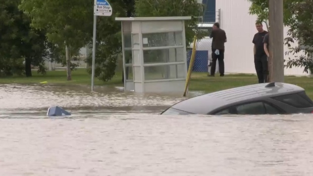 A Saskatoon intersection was overflowing with water on July 5, 2022. (Dan Shingoose/CTV News)