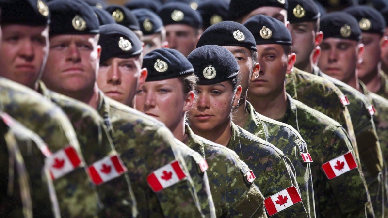 Members of the Canadian Armed Forces march during the Calgary Stampede parade in Calgary, Friday, July 8, 2016. THE CANADIAN PRESS/Jeff McIntosh