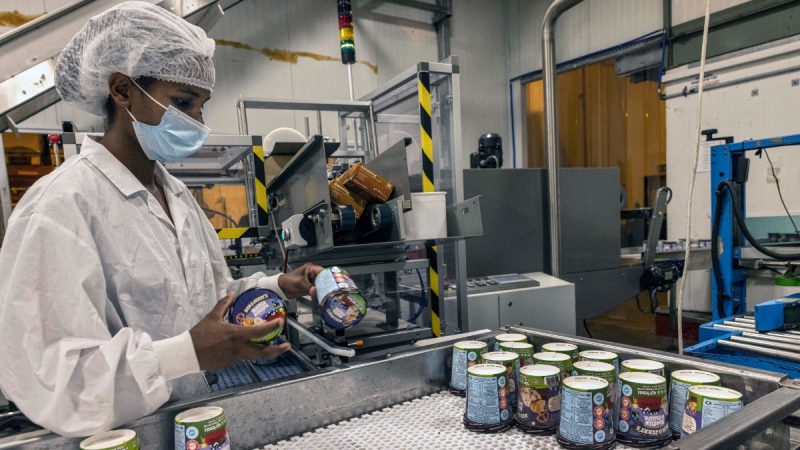 An Israeli works at the Ben & Jerry's ice-cream factory in the Be'er Tuvia Industrial area, July 20, 2021. (AP Photo/Tsafrir Abayov)