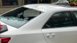This car was damaged after glass fell from Stantec Tower on Monday, July 4, 2022. (Amanda Anderson/CTV News Edmonton)
