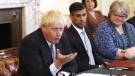 Britain's Prime Minister Boris Johnson, left, and Britain's Chancellor of the Exchequer Rishi Sunak, centre, take part in a cabinet meeting in Downing Street, London, July 5, 2022. (Ian Vogler/Pool Photo via AP)