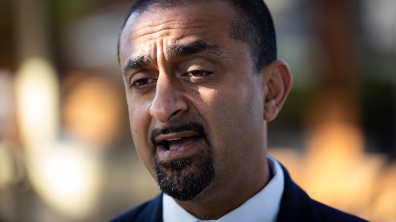 Ravi Kahlon, B.C. minister of jobs, economic recovery and innovation, speaks about the provincial COVID-19 vaccine card system that went into effect Monday, before having breakfast at a restaurant in Delta, B.C., on Wednesday, Sept. 15, 2021. THE CANADIAN PRESS/Darryl Dyck 