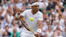Spain's Rafael Nadal returns to Taylor Fritz of the U.S. in a men's singles quarterfinal match on Day 10 of the Wimbledon tennis championships in London, July 6, 2022. (AP Photo/Kirsty Wigglesworth)