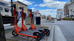 Three Neuron Mobility electric scooters are parked in Ottawa's ByWard Market on July 6, 2022. (Brenda Woods/CTV News Ottawa)