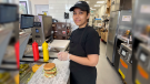 Niha Jaffarin, a manager at the London location of Odd Burger prepares a vegan sandwich, as seen on July 6, 2022. (Sean Irvine/CTV News London)
