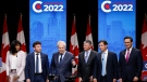 Candidates, left to right, Leslyn Lewis, Roman Baber, Jean Charest, Scott Aitchison, Patrick Brown, and Pierre Poilievre pose on stage following the Conservative Party of Canada English leadership debate in Edmonton, Alta., Wednesday, May 11, 2022.THE CANADIAN PRESS/Jeff McIntosh 