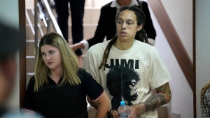 WNBA star and two-time Olympic gold medalist Brittney Griner is escorted to a courtroom for a hearing, in Khimki, just outside Moscow, Russia, July 1, 2022. (AP Photo/Alexander Zemlianichenko)
