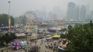 Visitors to the Stampede had to cope an Air Quality Health Index (AQHI) of ten with wildfire smoke blowing into Calgary on Sunday, July 18, 2021. The Calgary Stampede is raring to go Friday in its first return to full capacity since the start of the COVID-19 pandemic. (THE CANADIAN PRESS/Jeff McIntosh)