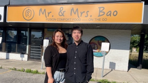 Julia Hou and Steven Mao are seen in front of their restaurant near the corner of Oxford Street and Wharncliffe Road in London, Ont. on July 7, 2022. (Sean Irvine/CTV News London)