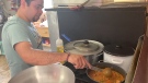 Kiranraj Kamath making one of his South Indian dishes. (Dylan Dyson/CTV News Ottawa)