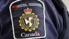 FILE - A Canada Border Services Agency (CBSA) patch is seen on an officer in Calgary on August 1, 2019. (THE CANADIAN PRESS/Jeff McIntosh)