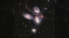 This image provided by NASA on Tuesday, July 12, 2022, shows Stephan's Quintet, a visual grouping of five galaxies captured by the Webb Telescope's Near-Infrared Camera (NIRCam) and Mid-Infrared Instrument (MIRI). (NASA, ESA, CSA, and STScI via AP)