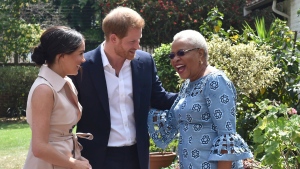 Britain's Prince Harry and his wife Meghan, Duchess of Sussex, meet with Graca Machel, the widow of the late Nelson Mandela, in Johannesburg, Wednesday Oct. 2, 2019. The couple are on the last day of their African Tour. (Itumeleng English/Pool Photo via AP)