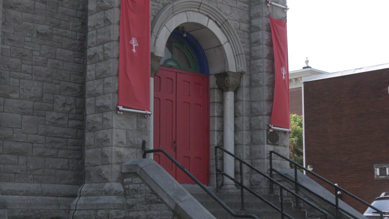 St. Brigid’s Church on St. Patrick St. Is adorned with flags and banners of The United People of Canada. (Colton Praill / CTV News) 