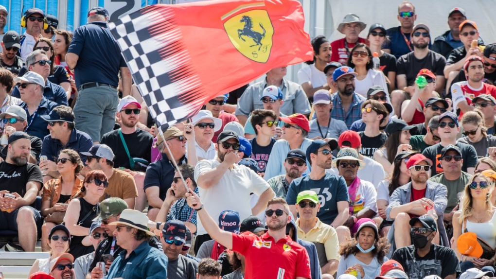 An F1 fan waves a Ferrari flag in Montreal