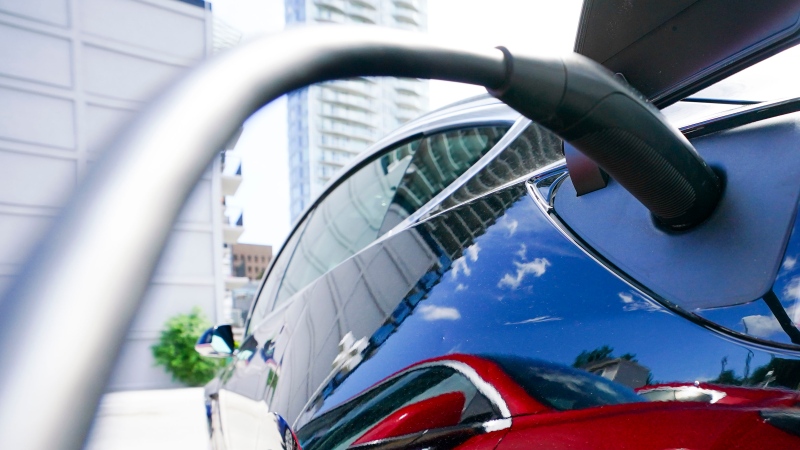 An electric vehicle is charged in Ottawa on Wednesday, July 13, 2022. THE CANADIAN PRESS/Sean Kilpatrick