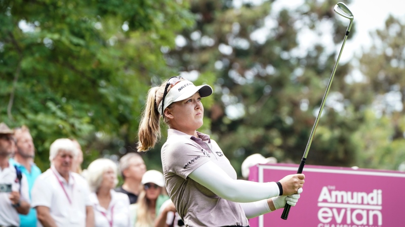 Brooke Henderson, of Canada, follows her ball after playing on the 2nd hole during the Evian Championship women's golf tournament in Evian, eastern France, Saturday, July 23, 2022. (Laurent Cipriani/AP Photo)