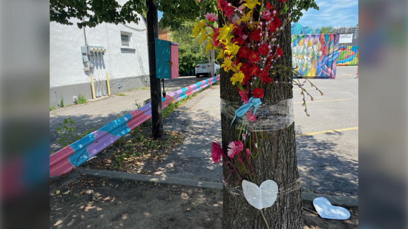 A memorial at a Vanier intersection for a woman struck and killed by a truck on Friday. (Natalie van Rooy/CTV News Ottawa)