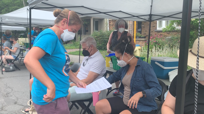 Dr. Nili Kaplan Myrth speaks with people waiting to receive their COVID-19 vaccine dose during Jabapalooza in the Glebe. (Jackie Perez/CTV News Ottawa) 