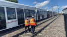 Alstom technicians on scene between Rideau and Lees LRT stations July 25, 2022. The train was offline due to what OC Transpo officials said was suspected lightning damage to the overhead power system. (Colton Praill/CTV News Ottawa)