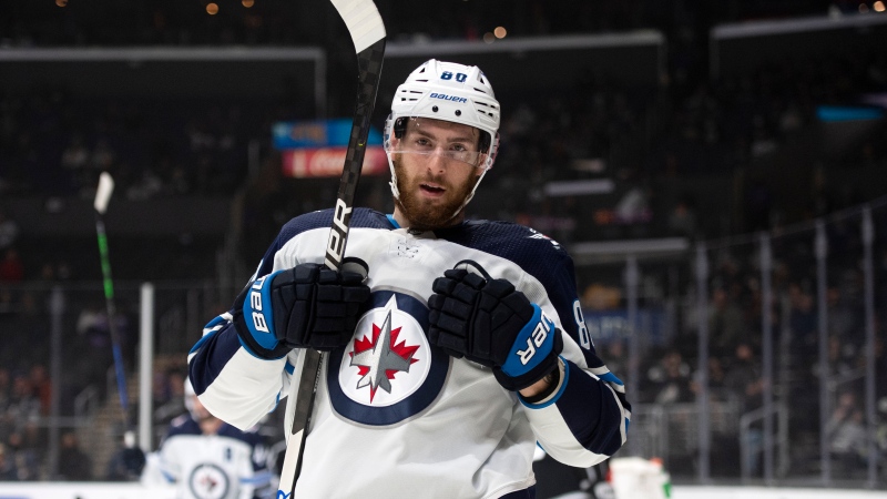 Winnipeg Jets center Pierre-Luc Dubois reacts after scoring a goal in the first period of the team's NHL hockey game against the Los Angeles Kings on Thursday, Oct. 28, 2021, in Los Angeles. (AP Photo/Kyusung Gong)