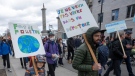 People mark Earth Day with a march, Friday, April 22, 2022 in Montreal. THE CANADIAN PRESS/Ryan Remiorz