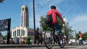 A cyclist rides his bike past the Atwater Market in Montreal on Thursday, September 4, 2014. -- FILE PHOTO (THE CANADIAN PRESS/Paul Chiasson)