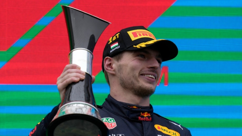 Red Bull driver Max Verstappen of the Netherlands celebrates on the podium after winning the Hungarian Formula One Grand Prix at the Hungaroring racetrack in Mogyorod, near Budapest, Hungary, July 31, 2022. (AP Photo/Darko Bandic)
