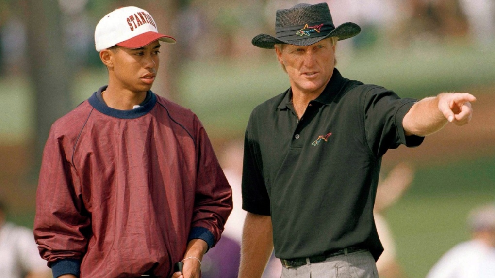 Tiger Woods with Greg Norman in 1995