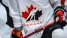 A Hockey Canada logo is shown on the jersey of a player with Canada’s national junior team during a training camp practice in Calgary, Aug. 2, 2022.THE CANADIAN PRESS/Jeff McIntosh 