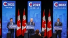 Candidate Jean Charest, centre, makes a point as Roman Baber, left, and Scott Aitchison look on at the Conservative Party of Canada English leadership debate in Edmonton, Alta., Wednesday, May 11, 2022.THE CANADIAN PRESS/Jeff McIntosh