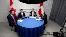 Debate moderator Rob Batherson, left to right, and Conservative Leadership candidates Roman Baber, Scott Aitchison and Jean Charest are shown during the Conservative Party leadership debate in Ottawa on Wednesday, August 3, 2022. THE CANADIAN PRESS/Adrian Wyld