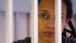 Brittney Griner looks through bars as she listened to the verdict standing in a cage in a courtroom in Khimki just outside Moscow, Russia, on Aug. 4, 2022. (Evgenia Novozhenina / Pool Photo via AP) 