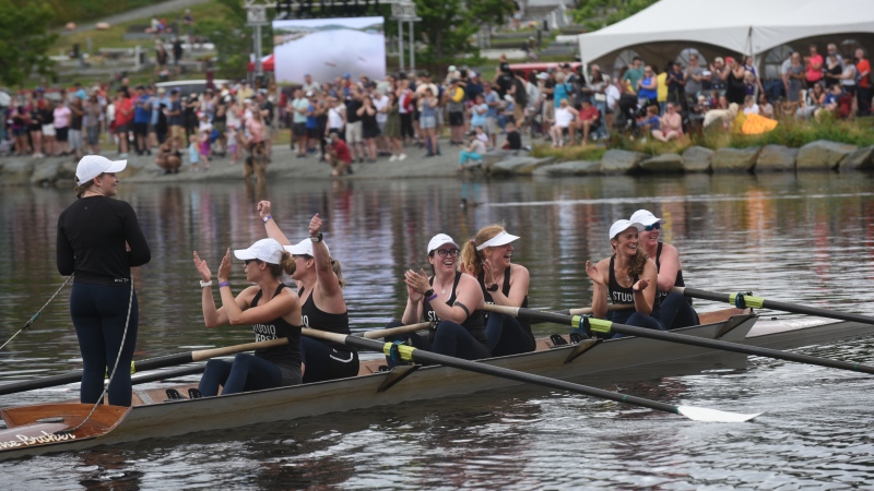 Members of the Studio Verso team celebrate as they cross the finish line after racing to victory in the women’s long course event at the Royal St. John's Regatta in St. John's, Thursday, August 4, 2022. Four crews of women rowers made history in a race from one end of Quidi Vidi Lake to the other along a course historically reserved for men. THE CANADIAN PRESS/Bud Gaulton