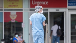 A health-care worker is shown outside a hospital in Montreal, Thursday, July 14, 2022, as the COVID-19 pandemic continues in the province. THE CANADIAN PRESS/Graham Hughes
