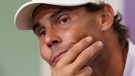 Spain's Rafael Nadal announces that he is withdrawing from the semi-final of the Gentlemen's Singles during a press conference at The All England Lawn Tennis Club, Wimbledon, Thursday, July 7, 2022. (Joe Toth/Pool Photo via AP)