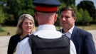 Minister of Foreign Affairs Melanie Joly and minister of Public Safety, Marco Mendicino, speak with Toronto Police super intendent Steve Watts of the Organized Crime Enforcement unit, following a press conference announcing new gun control laws, in Toronto, Friday, Aug. 5, 2022. THE CANADIAN PRESS/Cole Burston