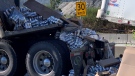 Cans of beer spill from a truck on the Mary Hill Bypass on Friday, Aug. 5, 2022. (Peter Bremner / CTV News Vancouver)