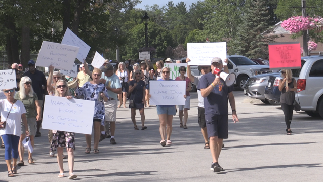 Several dozen people were on hand outside town hall on Friday, protesting the allegations of a cover-up by the town on Aug. 5, 2022. (Catalina Gillies/ CTV News).