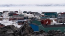 The village of Inukjuak is seen on the shore of Hudson Bay Thursday, May 12, 2022 in Inukjuak, Quebec. THE CANADIAN PRESS/Adrian Wyld
