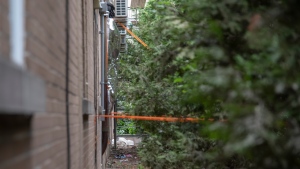 The back area of a motel in Montreal's St-Laurent borough where there was a shooting involving a police tactical unit is shown on Thursday, August 4, 2022. THE CANADIAN PRESS/Peter McCabe