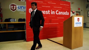 Former Unifor National President Jerry Dias walks from the podium after addressing the media, Tuesday, Jan. 8, 2019, in Windsor, Ont. (AP Photo/Carlos Osorio)