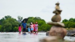 A family cools off in the Ottawa River in Ottawa, July 20, 2022. THE CANADIAN PRESS/Sean Kilpatrick