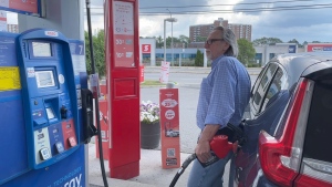 A Gatineau resident fills up the gas tank at a station in Ottawa on Sunday. He says the price of gas is about 17 cents a litre cheaper in Ottawa. (Dave Charbonneau/CTV News Ottawa) 