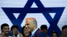 Israeli Prime Minister Yair Lapid on stage with supporters during the launch of his Yesh Atid party's election campaign in Tel Aviv, Israel, on Aug. 3, 2022. (Oded Balilty / AP)