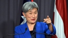 Australia's Foreign Minister Penny Wong gestures during a press conference at Parliament House in Canberra, on Aug. 8, 2022. (Mick Tsikas / AAP Image via AP)