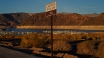 A sign marks the water line from 2002 near Lake Mead at the Lake Mead National Recreation Area, on July 9, 2022, near Boulder City, Nev. (John Locher / AP) 