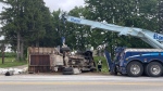 No injuries reported after a dump truck flipped over on Highbury Ave. in London, Ont. on Aug. 8, 2022. (Sean Irvine / CTV London)