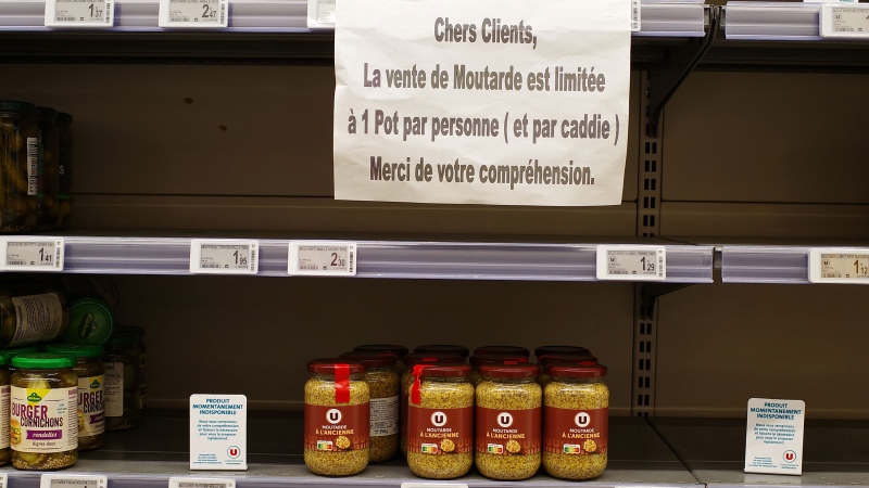 A sign in a French supermarket is pictured here in June, indicating that the sale of mustard is limited to one jar per person per trolley. (Mathieu Thomasset/Hans Lucas/Reuters/CNN)
